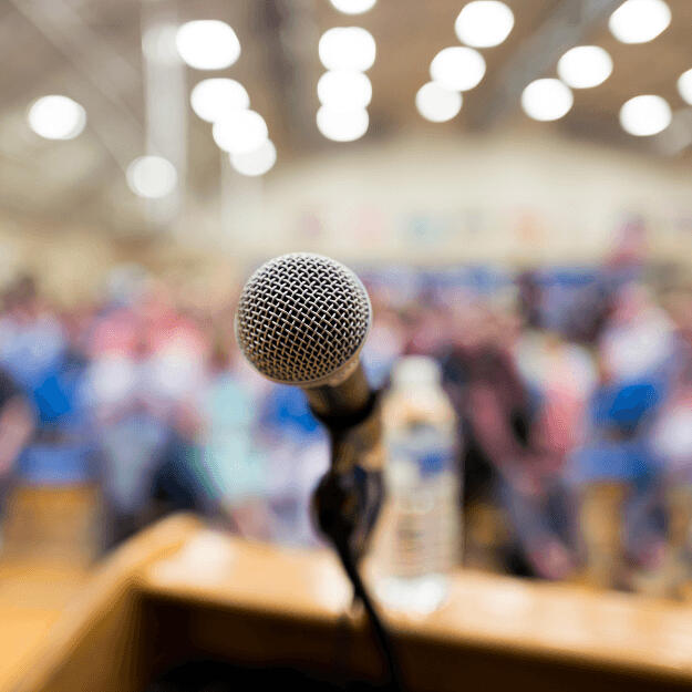 microphone in front of a crowd